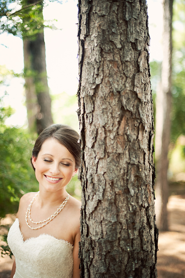 portrait of the bride leaning against tree - photo by Houston based wedding photographer Adam Nyholt